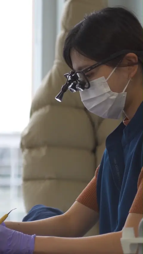 Suji Kang providing care at Simply Smile Studio